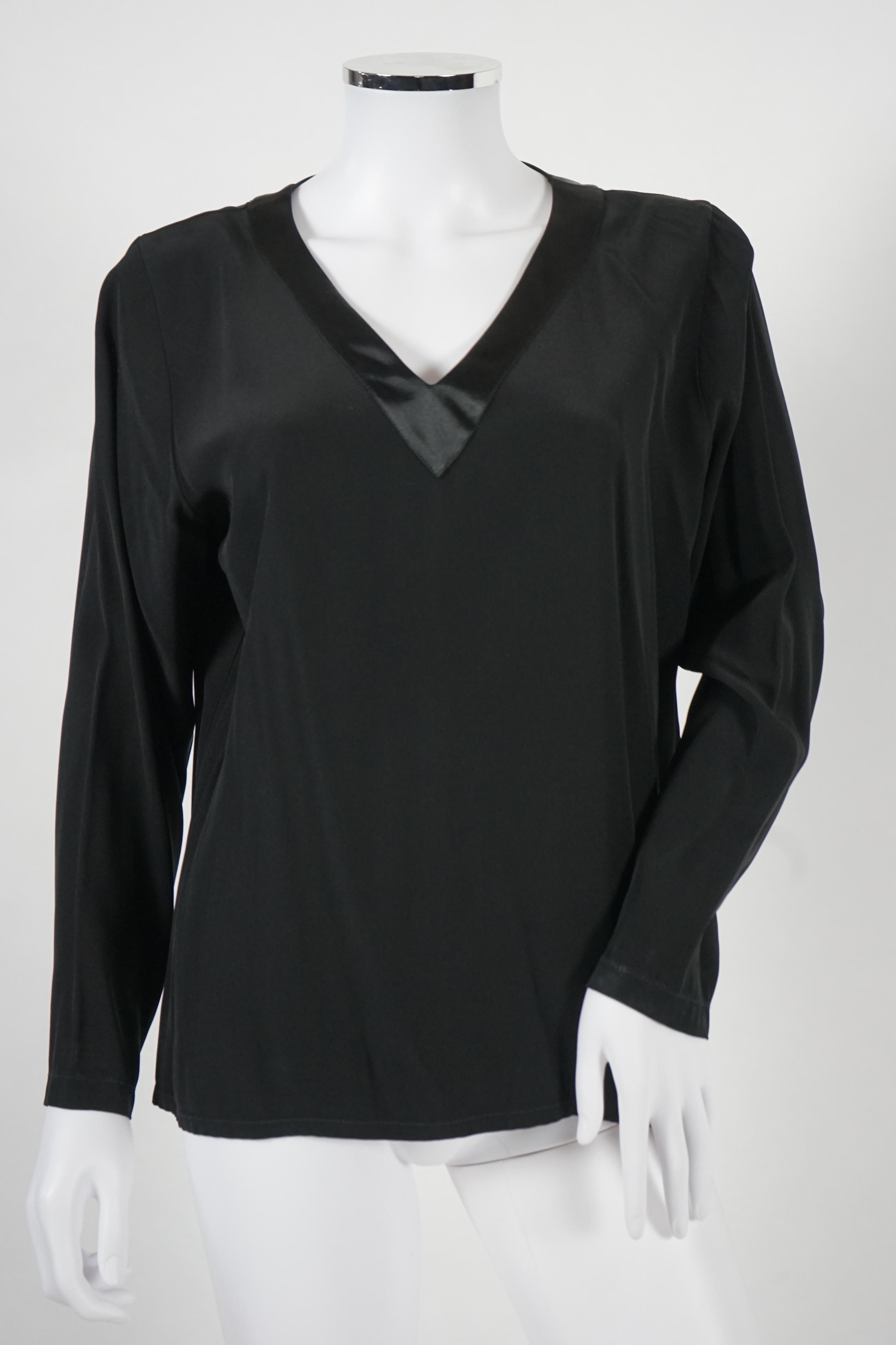 Four vintage Yves Saint Laurent variation lady's tops, F 40 (UK 12).Proceeds to Happy Paws Puppy Rescue